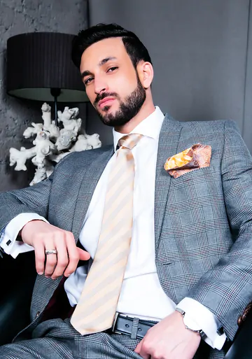 Men in suits fucking on a sofa