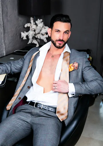 Men in suits fucking on a sofa