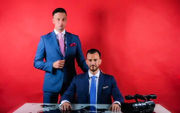 Men in blue suits having sex