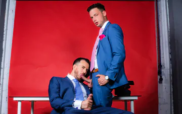 Men in blue suits having sex