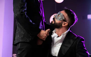 Masquerade ball men having sex