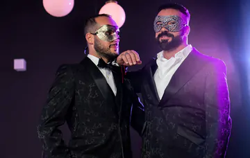 Masquerade ball men having sex