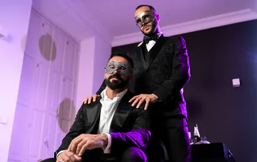 Masquerade ball men having sex