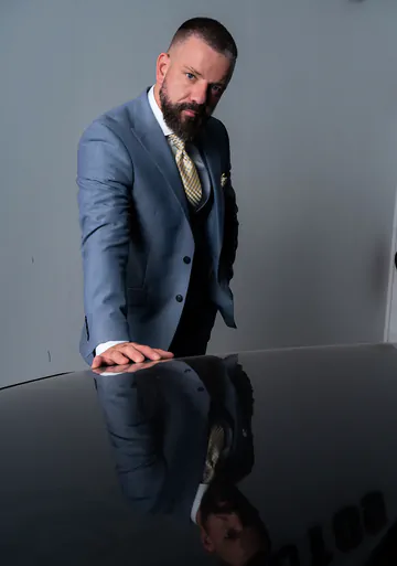 Men in a garage having sex