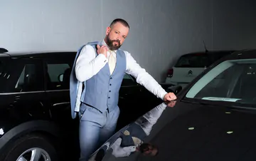 Men in a garage having sex