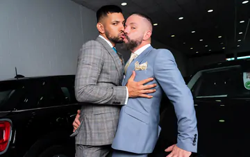 Men in a garage having sex