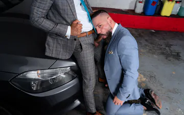 Men in a garage having sex