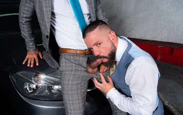 Men in a garage having sex