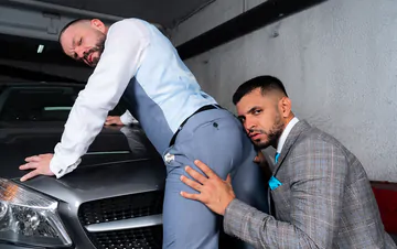 Men in a garage having sex