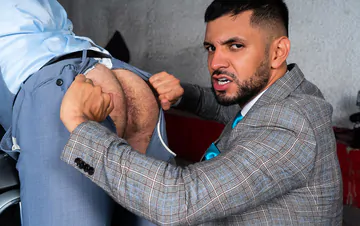 Men in a garage having sex