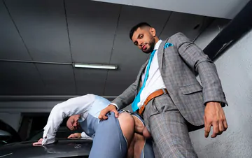 Men in a garage having sex