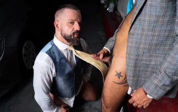 Men in a garage having sex