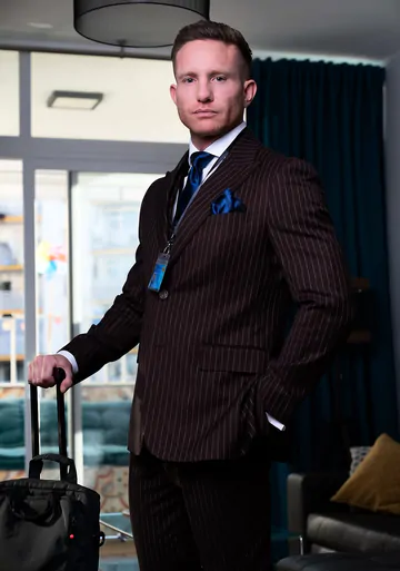 Guys in brown suits having sex