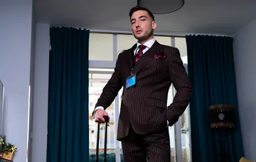 Guys in brown suits having sex