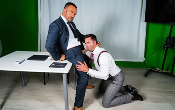 Men in suits having gay sex