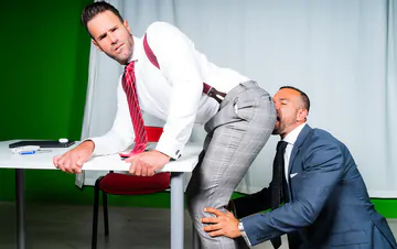 Men in suits having gay sex