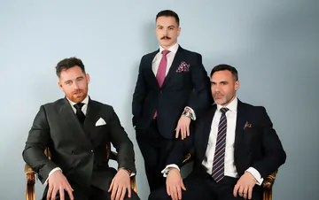 Three guys in suits having sex