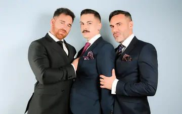 Three guys in suits having sex