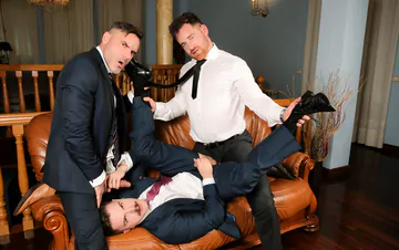 Three guys in suits having sex