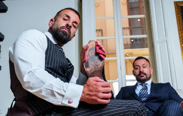 Men in suits having kinky sex