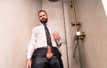 Clothed man fucking in the shower