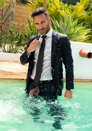 Clothed men fucking in the pool