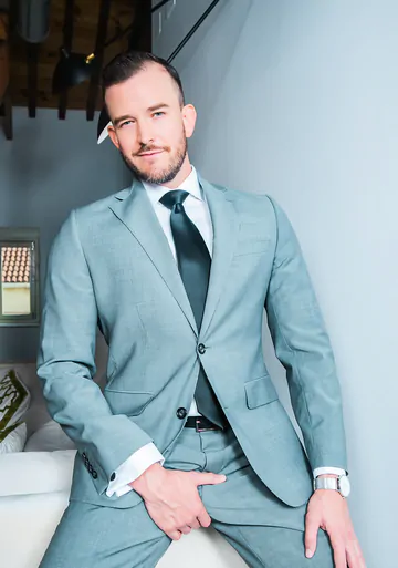 Men in suits fucking on a sofa