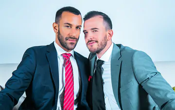 Men in suits fucking on a sofa