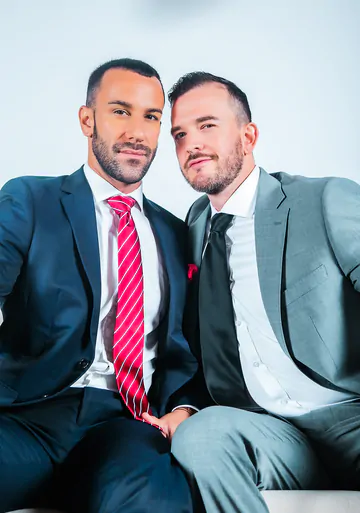 Men in suits fucking on a sofa