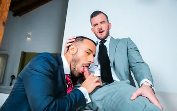 Men in suits fucking on a sofa