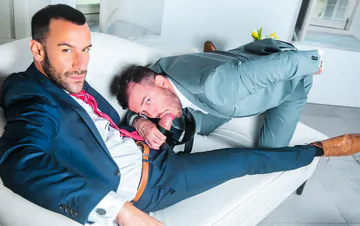 Men in suits fucking on a sofa