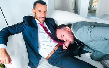 Men in suits fucking on a sofa