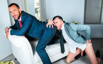 Men in suits fucking on a sofa
