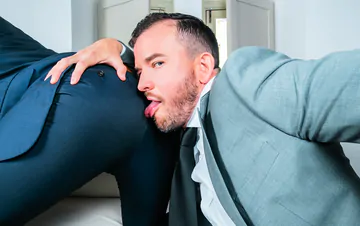 Men in suits fucking on a sofa