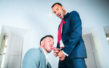 Men in suits fucking on a sofa