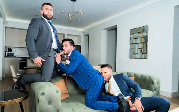 Men in suits having a threesome