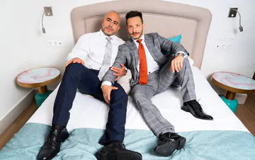 Clothed guys fucking in the shower