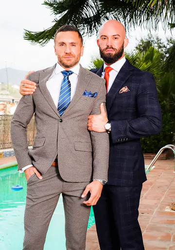 Two guys in suits fucking