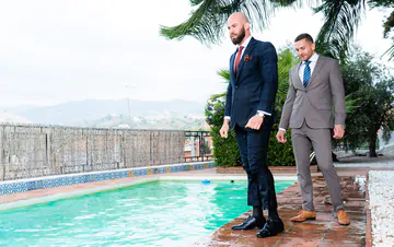 Two guys in suits fucking