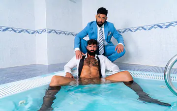 Clothed men fucking in a hottub