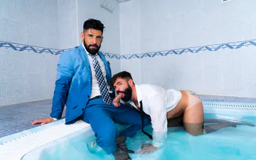Clothed men fucking in a hottub