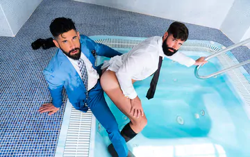 Clothed men fucking in a hottub