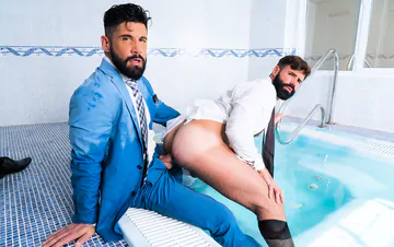 Clothed men fucking in a hottub
