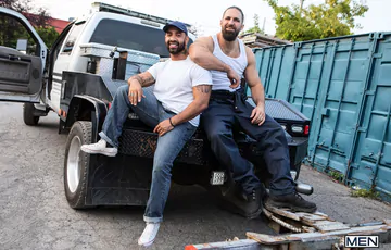 Rugged men fucking in the workshop