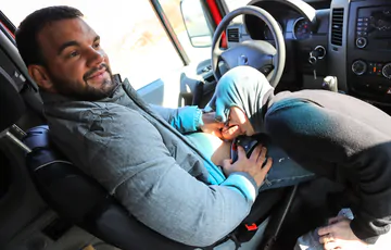 Man in a car gets head