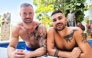 Tattooed man fucking ass bareback