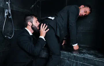 Guys in suits taking a shower