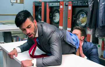 Men in a laundry having sex