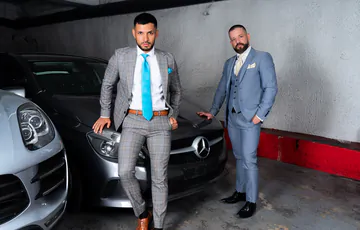 Men in a garage having sex