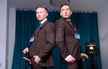 Guys in brown suits having sex